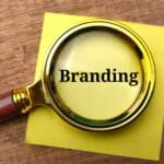 Vintage magnifying glass and sticky note with the word Branding